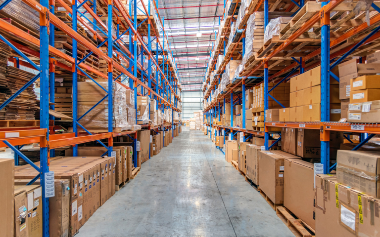 Blue And Orange Racks In Warehouse