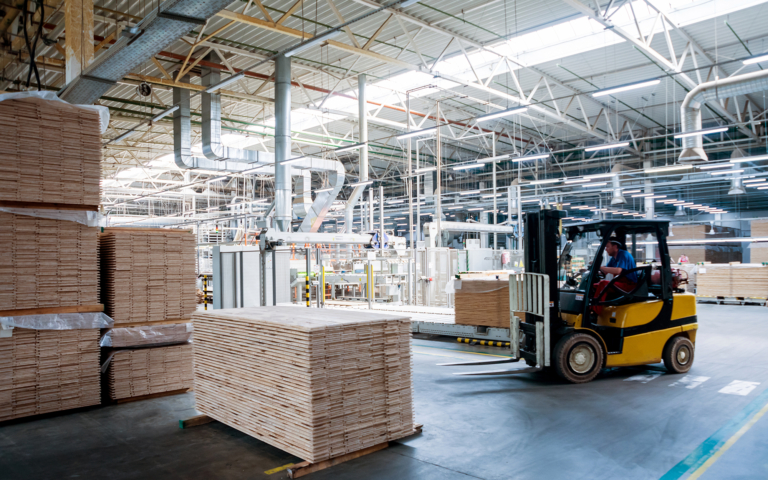 Forklift Driving Around Warehouse Floor