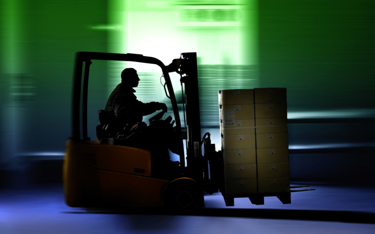Forklift Driving With Blue And Green Blur