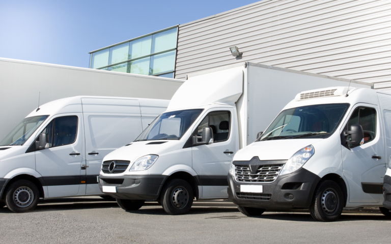 Logistics vans and trucks at a warehouse
