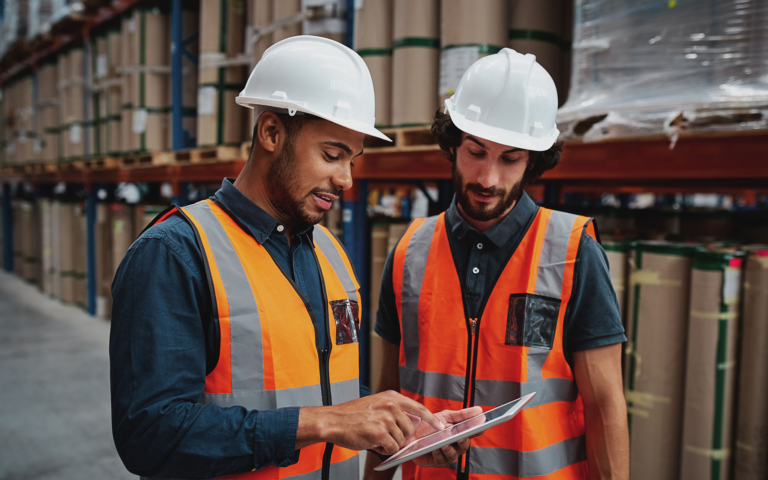 Warehouse team planning on a tablet