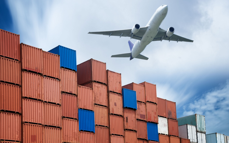 Cargo plane over container yard