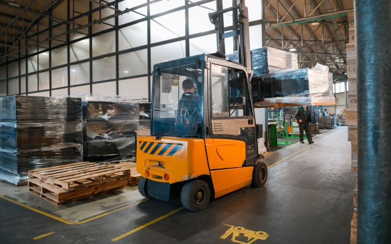 Warehouse workers consolidating freight shipments