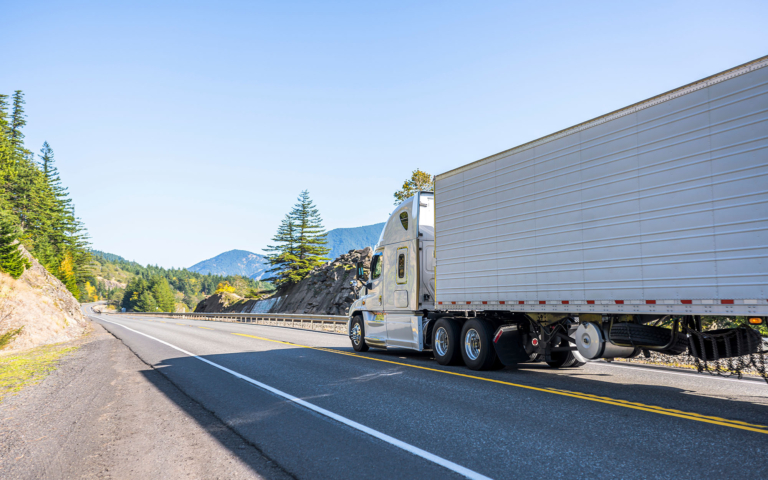 LTL freight truck driving down the highway
