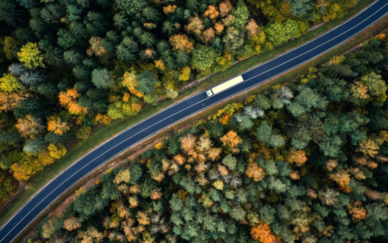Overhead view of a cargo truck on the road illustrating an optimized route