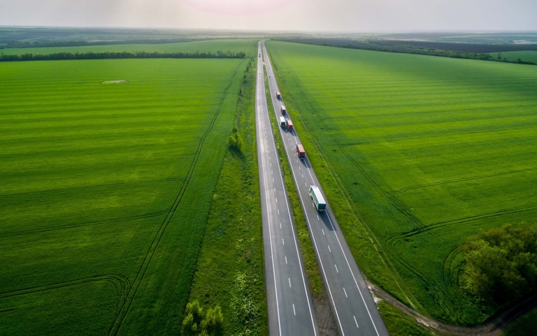 Carrier trucks on the highway representing freight procurement capacity across lanes