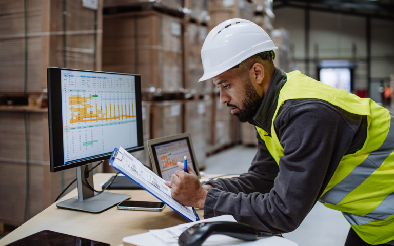 Parcel optimization specialist reviewing shipping data