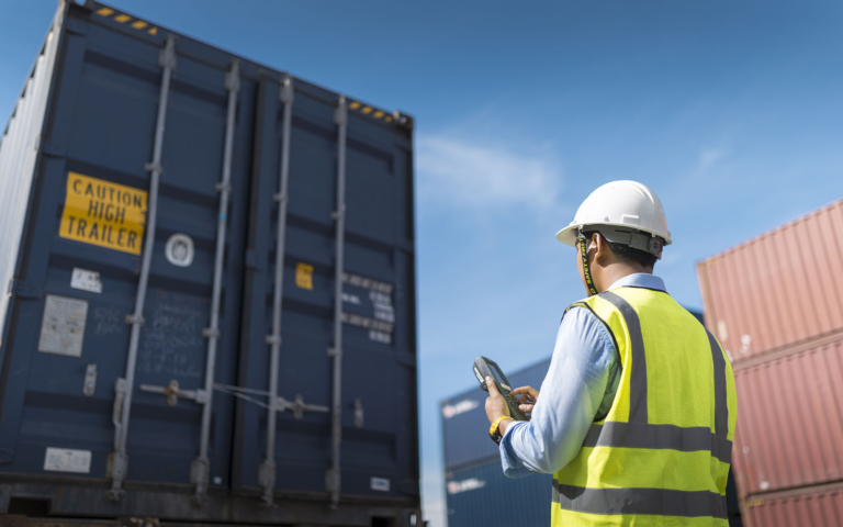 Trade compliance manager reviewing regulations