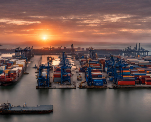 Container ships loading at a busy port.