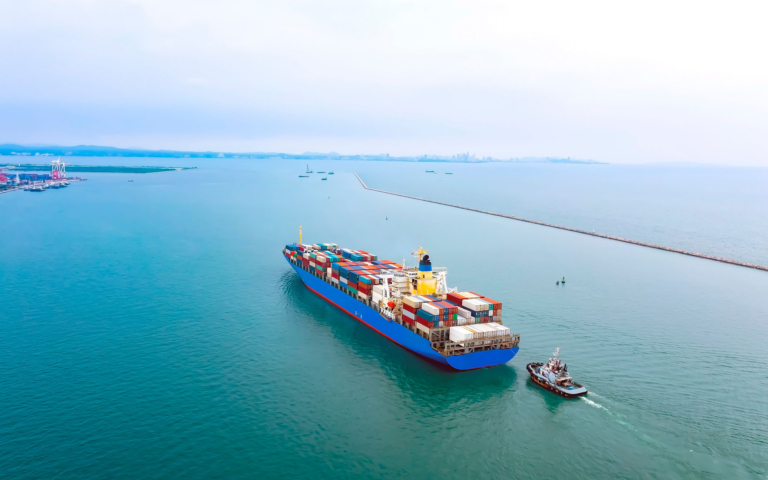 Blue container ship carrying CargoTrans international ocean freight