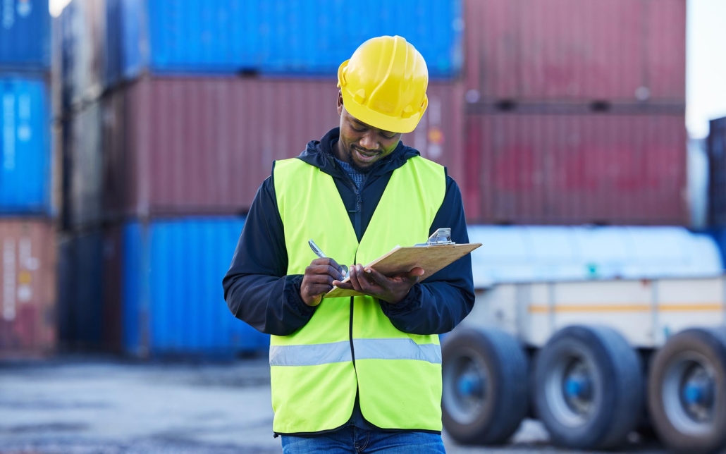freight worker looking at clipboard