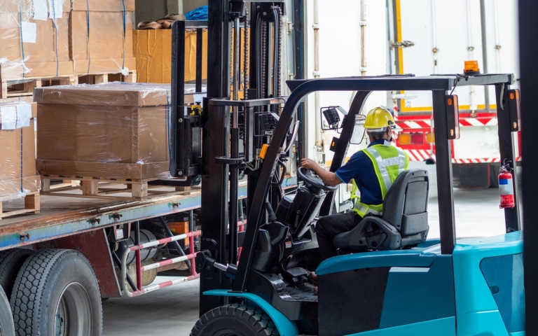Workers loading boxes onto a truck