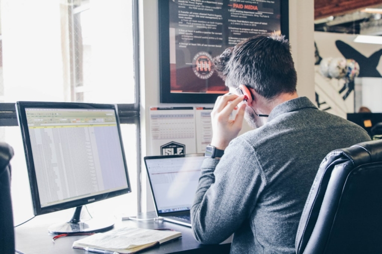 Dispatcher reviewing carrier status updates in a portal